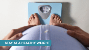 A pregnant woman stands on a scale, tracking her weight as part of prenatal care.